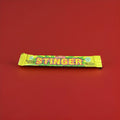 Yellow and green wrapped lemon flavoured chew bar with a fizzy sherbet centre