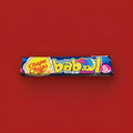 Fruit flavoured tongue painting bubblegum squares in a blue and yellow wrapper on a red background 