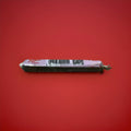 Individually wrapped black and purple chew bar with a blackcurrant and liquorice flavour on a red background 