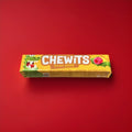 Fruit salad flavoured Chewits in a yellow wrapper on a red background 