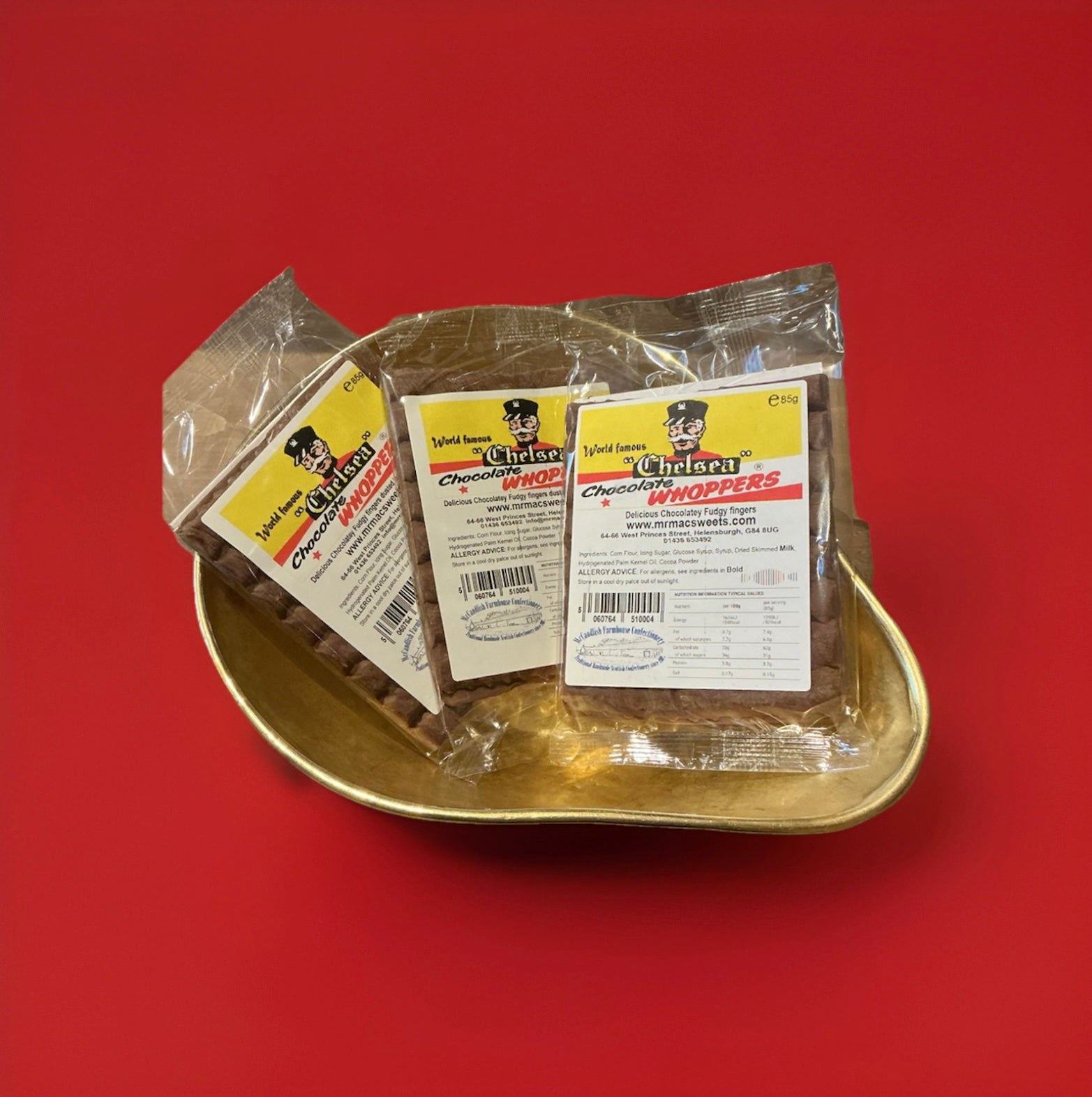 Chelsea whoppers chocolate fudge bars in a gold bowl with a red background 
