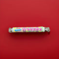 Round fizzy sherbet discs wrapped in multi coloured packaging 