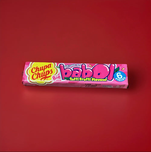 Tutti fruity bubblegum squares in a pink wrapper on a red background 