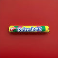 Multicoloured disk-shaped fizzy sweets with a fruit flavour wrapped in multi coloured paper 