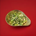 Haribo terrific turtle jelly sweets in a gold bowl on a red background 