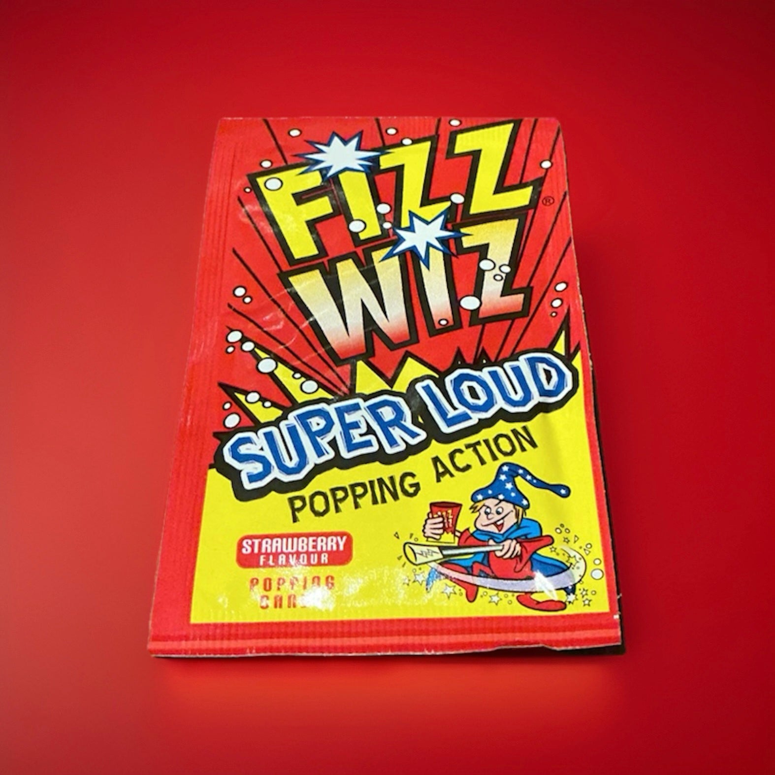 A red and yellow packet of strawberry flavoured popping Candy 