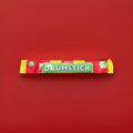 Drumstick lolly flavoured chew bar in a red yellow and green wrapper on a red background 