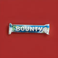Two segments of soft coconut strands coated in milk chocolate in a blue and white wrapper 