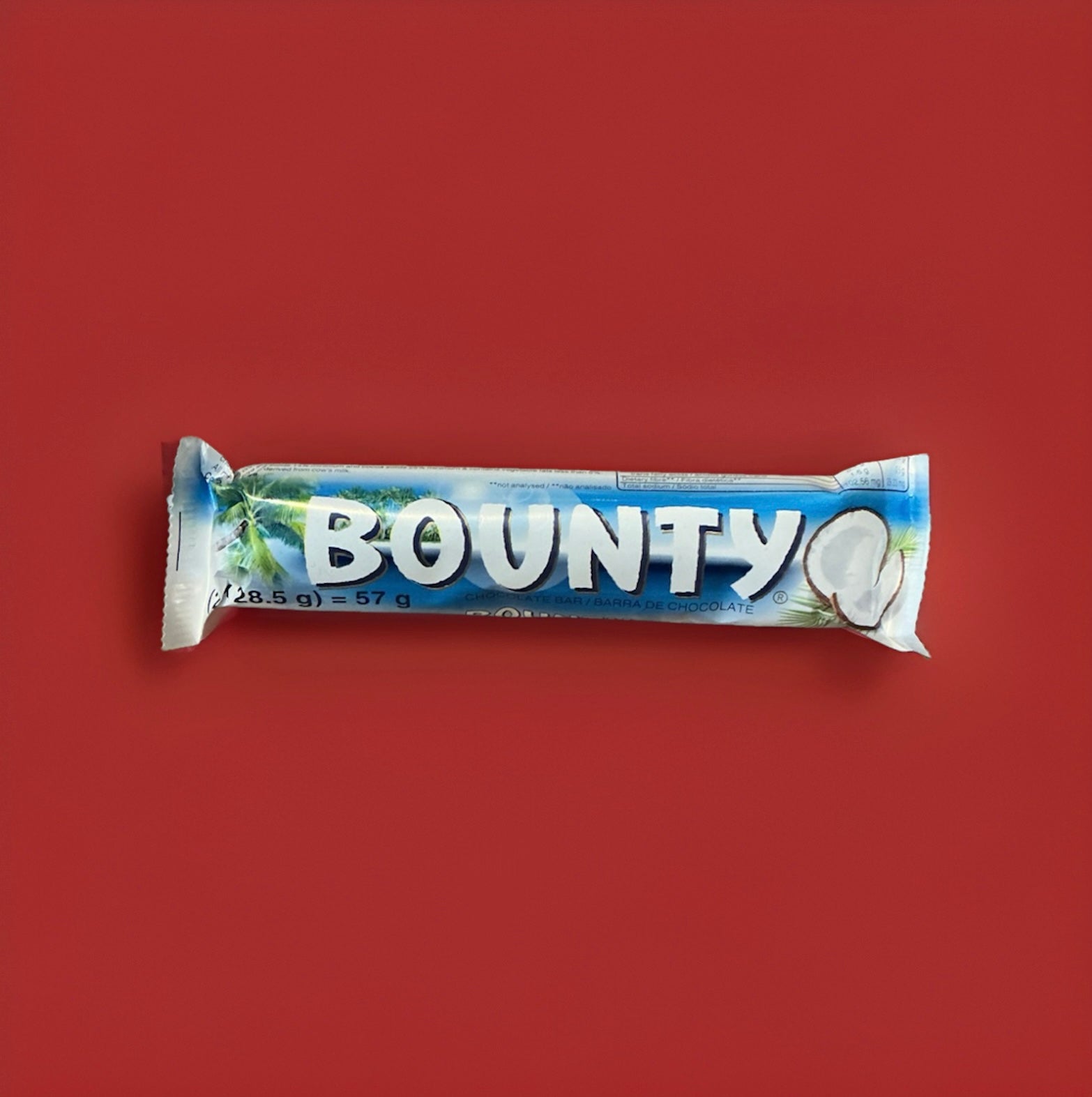 Two segments of soft coconut strands coated in milk chocolate in a blue and white wrapper 