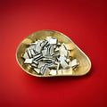 1 kilogram of liquorice and mint fondant black and white mints in a gold bowl with a red background 